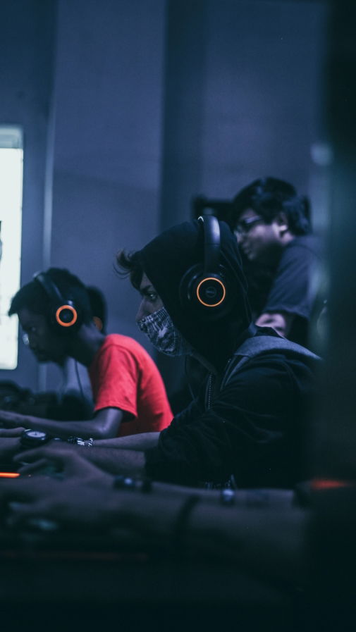 group of computer gamers in a computer shop